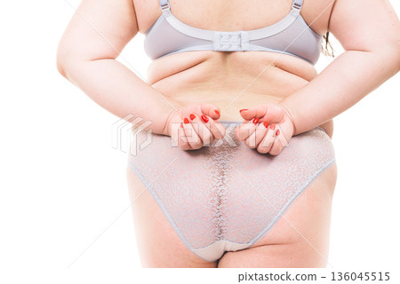 Plus size woman in lingerie back view. 136045515