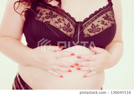 Plus size woman wearing bra lingerie Plus size woman wearing bra lingerie 136045516