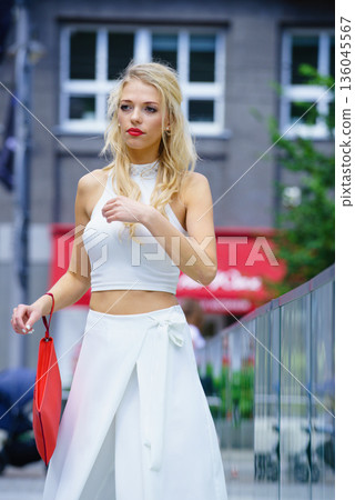 Woman wearing crop top and culottes 136045567