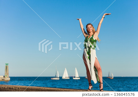 Fashion woman against sea. 136045576