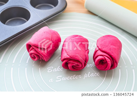 Shaping beetroot bread dough 136045724
