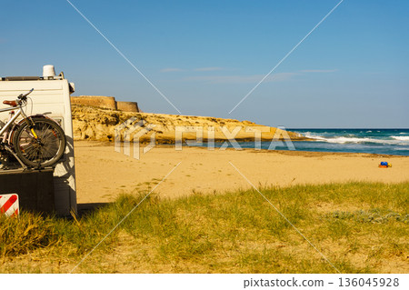 Camper car on beach in Spain. 136045928