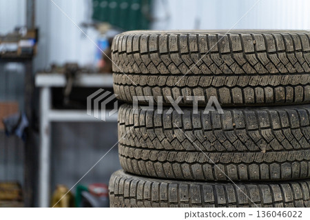 A stack of winter tires in a car repair shop 136046022