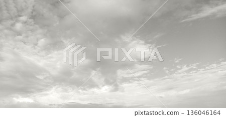 Calm gray sky with clouds over horizon for contemplative stock imagery Demonstration Color of the Year 2026 Calm gray sky with clouds over horizon for contemplative stock imagery Demonstration Color of the Year 2026 136046164