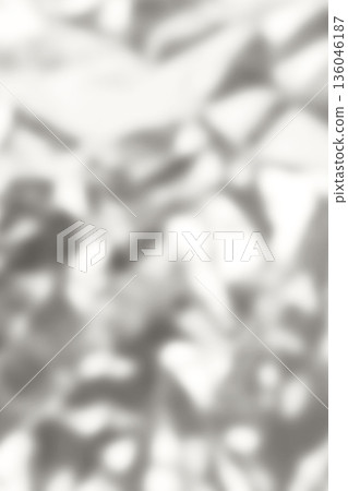 Soft gray abstract leaves pattern background with blurred silhouettes for serene nature mood. Demonstration Color of the Year 2026. 136046187