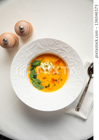 Creamy vegetable soup with herbs and cream Creamy vegetable soup with herbs and cream 136046373