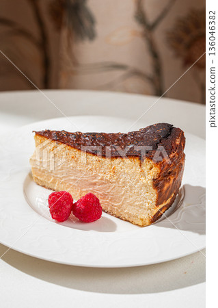 Spanish cheesecake slice with raspberries Spanish cheesecake slice with raspberries 136046382