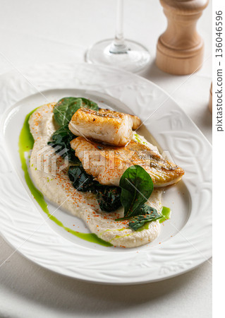 Pan seared white fish with creamy sauce Pan seared white fish with creamy sauce 136046596