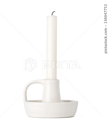 Minimalist white ceramic candle holder with a white wax candle isolated on a white background. home decor and interior design concepts 136047753