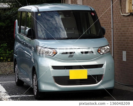 Car parked in parking lot 136048209