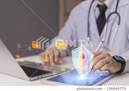 Healthcare data protection concept. Doctor manages electronic patient records with secure network. Virtual shield icon cybersecurity, confidentiality, and information safety in modern hospital. 136048770
