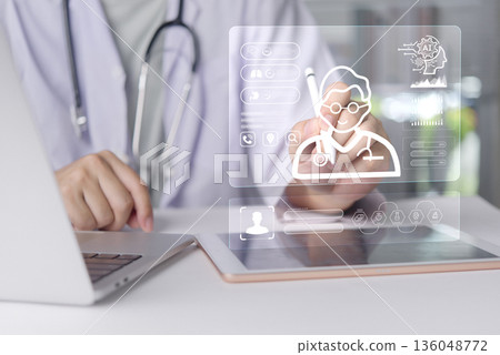 Doctor uses AI for patient data analysis on virtual screen. Medical technology, digital healthcare, electronic health record EHR, diagnosis with artificial intelligence in modern hospital. 136048772