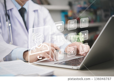 Doctor uses laptop remote care and EHR management, telemedicine consult, patient records, prescription, insurance, diagnosis, data security, healthcare technology, digital health, cloud workflow. Doctor uses laptop remote care and EHR management, telemedicine consult, patient records, prescription, insurance, diagnosis, data security, healthcare technology, digital health, cloud workflow. 136048787