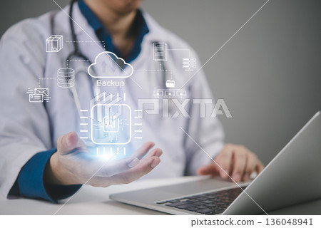 AI, healthcare doctor demonstrates cloud backup for medical data and EHR on an AI platform, ensuring security and resilient storage that supports telemedicine and faster clinical decisions 136048941