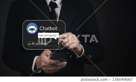 AI, chatbot businessman holds a phone chatting with a virtual assistant UI in a minimal dark setting for customer service 136049067