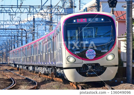 Keio 2000 series 2701F with NEW2000 headmark running with Mount Fuji in the background 136049096
