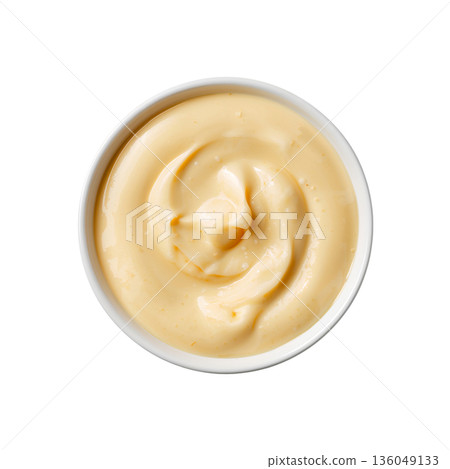 Creamy Sauce Sits in a Small White Bowl on a Plain Background Ready for Use in Meals 136049133