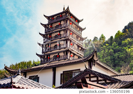 Chongqing China 4.7.2025. Traditional Chinese pagoda tower with curved tiled roofs Chongqing China 4.7.2025. Traditional Chinese pagoda tower with curved tiled roofs 136050196