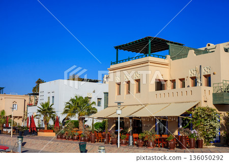 El Gouna Egypt 2.11.2025. A building with a green awning and a white roof El Gouna Egypt 2.11.2025. A building with a green awning and a white roof 136050292