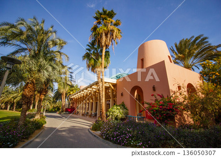 El Gouna Egypt 2.11.2025. A building with a large archway and a palm tree in front of it El Gouna Egypt 2.11.2025. A building with a large archway and a palm tree in front of it 136050307