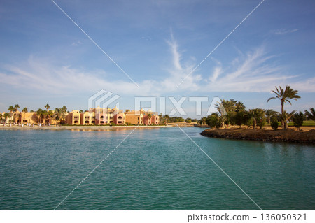 El Gouna Egypt 2.11.2025. A beautiful blue body of water with a small island in the middle El Gouna Egypt 2.11.2025. A beautiful blue body of water with a small island in the middle 136050321