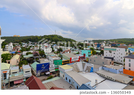 Iceland Phu Quoc Vietnam 5.7.2025. A city view with many buildings and a tall tower Iceland Phu Quoc Vietnam 5.7.2025. A city view with many buildings and a tall tower 136050349