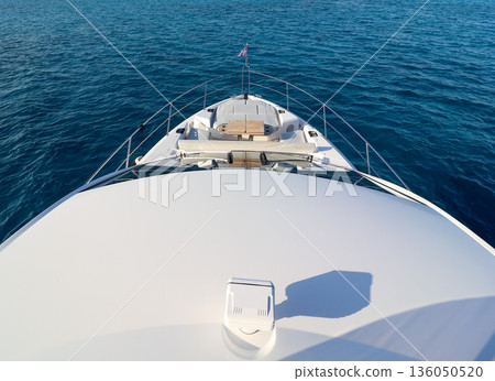 A boat is shown from the front, with the water and sky in the background 136050520