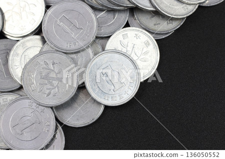 An image of investment made up of many stacked Japanese one-yen coins An image of investment made up of many stacked Japanese one-yen coins 136050552