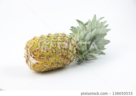 A simple pineapple lying on a white background A simple pineapple lying on a white background 136050555