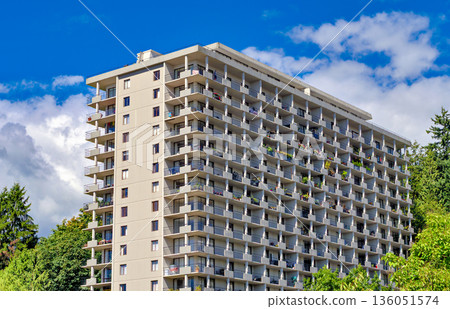 Back side of apartment residential building on blue sky background Back side of apartment residential building on blue sky background 136051574