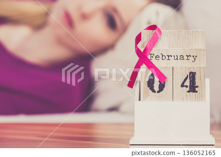 Woman on bed, world breast cancer day on calendar Woman on bed, world breast cancer day on calendar 136052165