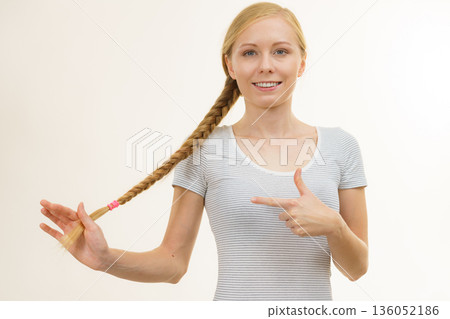 Blonde young woman with braid hair 136052186