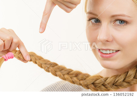 Blonde young woman with braid hair 136052192