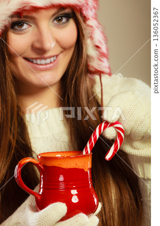Christmas girl with mug and cane. Christmas girl with mug and cane. 136052367