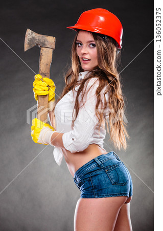Sexy strong woman feminist with axe working. 136052375