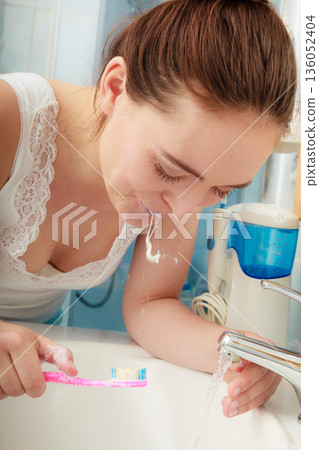 Woman brushing cleaning teeth. Oral hygiene. Woman brushing cleaning teeth. Oral hygiene. 136052404