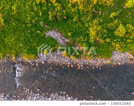 Beautiful morning view in Indonesia, panoramic landscape of rice fields with mountain ranges and clear sky 136052848