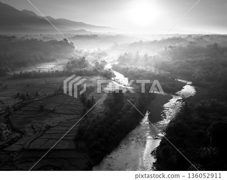 Beautiful morning view in Indonesia, panoramic landscape of rice fields with mountain ranges and clear sky 136052911