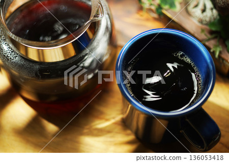 Coffee poured into mug Coffee poured into mug 136053418