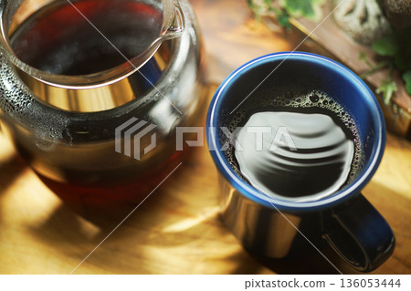 Coffee poured into mug 136053444