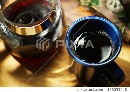 Coffee poured into mug Coffee poured into mug 136053448