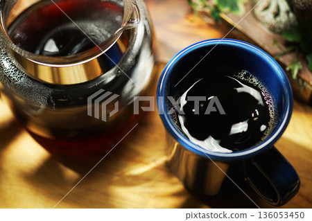 Coffee poured into mug Coffee poured into mug 136053450