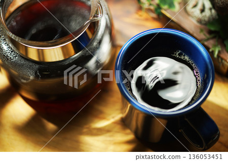 Coffee poured into mug 136053451