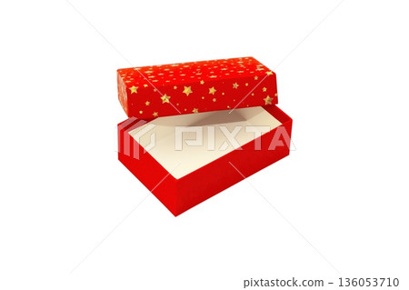 A Red Gift Box with Gold stars is Isolated White Background Cutout 136053710
