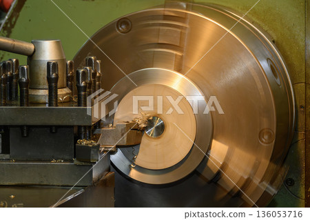 Rough Cut Metal Machining Process on Lathe Machine in Industrial Manufacturing Environment Rough Cut Metal Machining Process on Lathe Machine in Industrial Manufacturing Environment 136053716