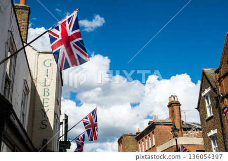 A historic brick building with lattice windows under bright sunlight in Windsor, a suburb of London 136054397