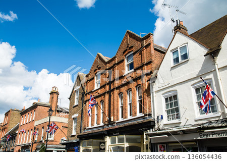 A historic brick building with lattice windows under bright sunlight in Windsor, a suburb of London A historic brick building with lattice windows under bright sunlight in Windsor, a suburb of London 136054436