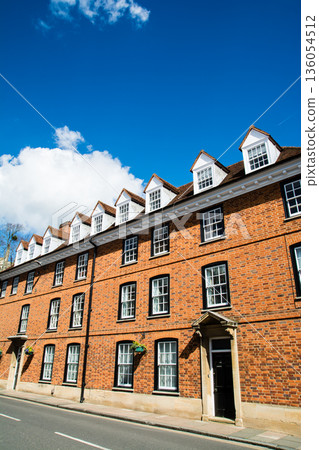 A historic brick building with lattice windows under bright sunlight in Windsor, a suburb of London 136054512