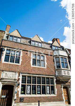 A historic brick building with lattice windows under bright sunlight in Windsor, a suburb of London 136054706