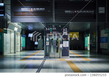 On a deserted train platform on a deserted night On a deserted train platform on a deserted night 136055233